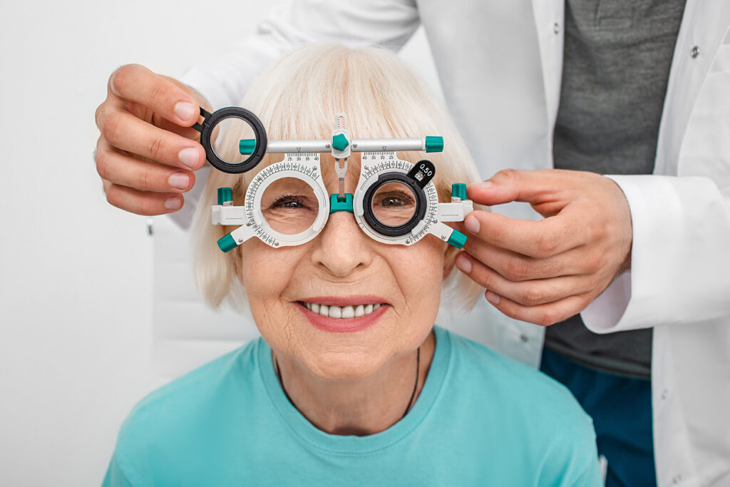 Smiling,Senior,Woman,Wearing,Optometrist,Trial,Frame,At,Ophthalmology,Clinic.